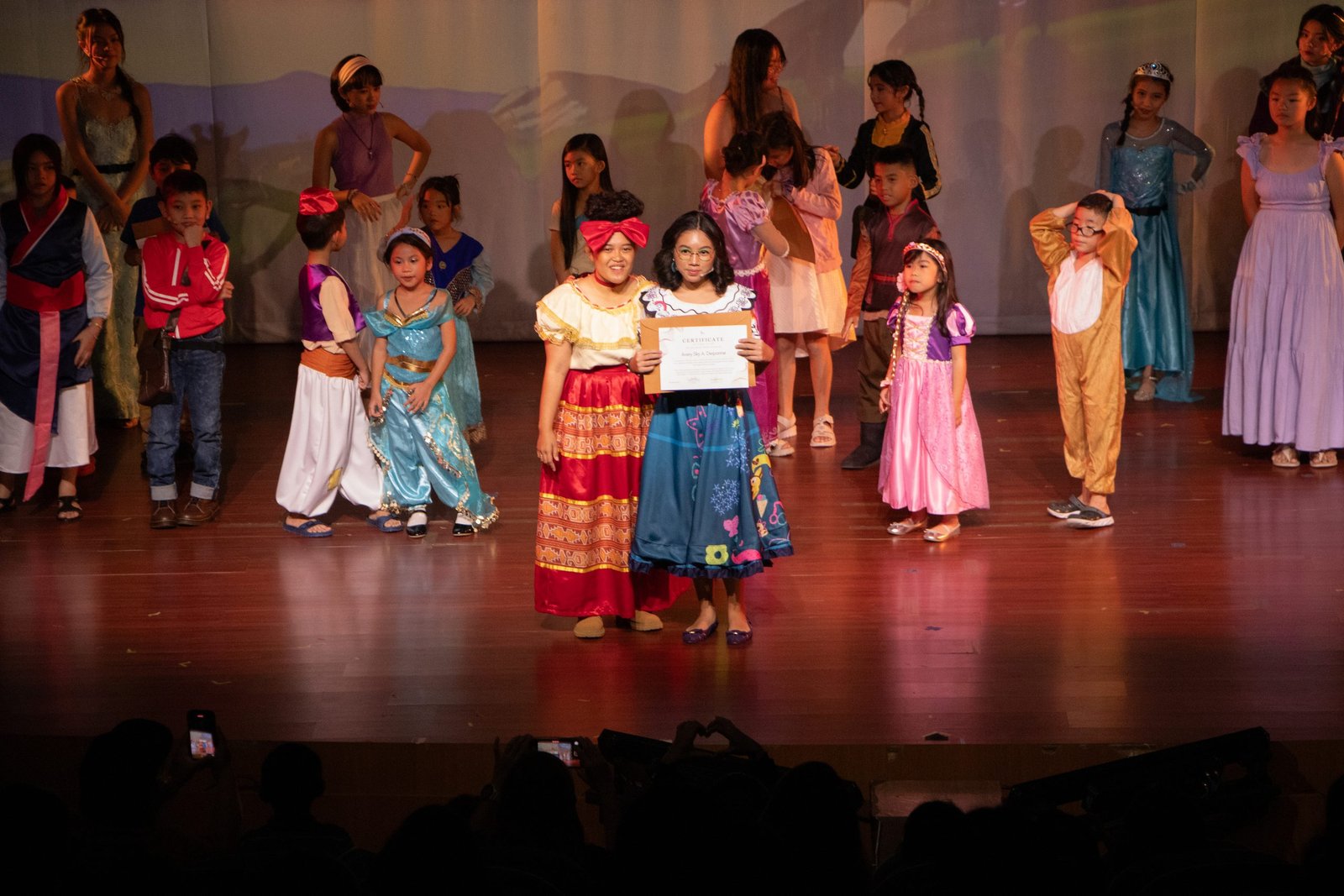 Students singing together in an Own the Room group class.